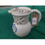 Early white ground stoneware Delft puzzle jug with blue and yellow decoration