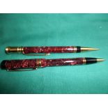 Maroon mottled cased Parker biro and propelling pencil
