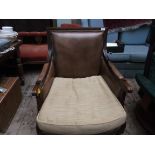 Oak framed fireside chair on tapering fluted legs, the studded back,