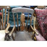 Early 20th century fireside chair in mixed woods with central carved splat and 2 vertical sticks to