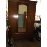 Edwardian inlaid mahogany wardrobe with long base cupboard fitted brass pear drop handles,