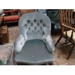 Victorian fireside armchair on reeded feet on castors,