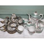 Light green lustre 6 piece oriental tea service and another brown ground decorative 6 piece service