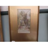 Gilt framed watercolour of a street scene signed G.S.