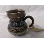 Early 20th century Doulton Lambeth cream jug with silver rim believed London 1919,