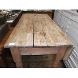 Rectangular topped half drop leaf striped pine kitchen table on 4 turned tapering feet