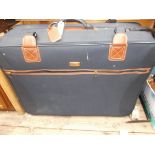 Large blue canvas suitcase