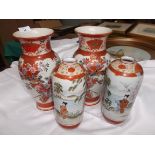 Pair of satsuma style urn shaped vases in traditional colours decorated Geisha Girls beside Acacia