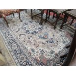 Light brown blue and beige patterned tasselled carpet (100" x 66"),
