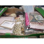 Sewing box of assorted fabric off cuts,