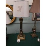 Brass corinthian column based table lamp with beige parchment shade