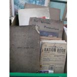 Selection of early ration books and WW I Army instruction books with a 1923 scrap book illustrated