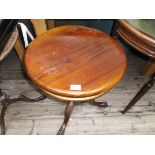 Circular topped side table on carved tricorn base on claw feet