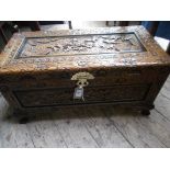 Heavily carved ornate Oriental storage box, the interior lined with camphor wood,