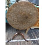 Oak circular tilt topped side table on tricorn base (top 23 1/2" diam.