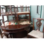 Rich mahogany wind out dining table (40" x 72" when fully extended) on bulbous claw and ball feet