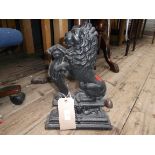 Black painted cast iron doorstop in the shape of a lion