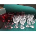 Selection of cut glass sherries and liqueurs together with 8 cranberry glass wine goblets