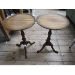 Pair of mahogany circular topped side tables each on tricorn base