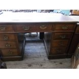 Oak partners desk, the top inlaid maroon tooled leather,