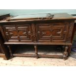 Carved oak rectangular topped double doored storage cabinet,