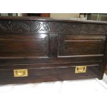 Antique dark oak carved blanket chest with double panel to top and lower base drawer with brass