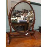 Mahogany framed bevel edged oval toilet mirror