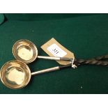 Pair of plated and ebony handled tody spoons