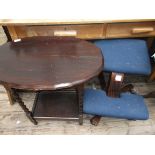 Oval topped dark oak twist stemmed side table with undershelf and an adjustable low blue canvas