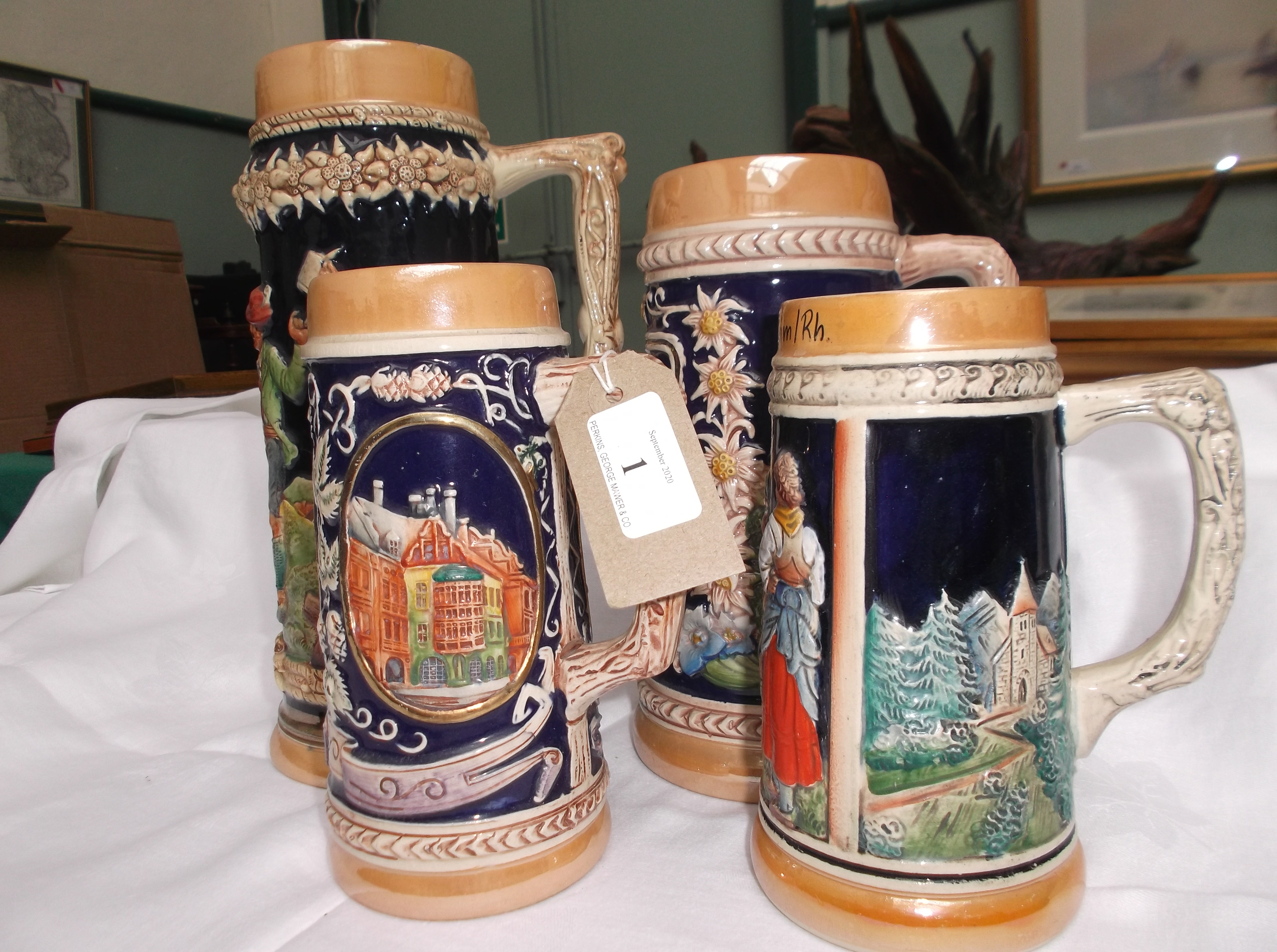4 handled multi-coloured German stoneware ale mugs with raised multi-coloured decoration