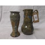 Decorative multi-coloured Doulton Lambeth green ground flower vase and a jug vase in similar style