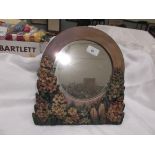 Circular framed bevel edged table mirror with raised floral decoration to base and sides