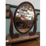 Mahogany oval framed toilet mirror on rectangular base on bun feet