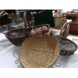 Decorative circular basket with metal ropework and floral border,