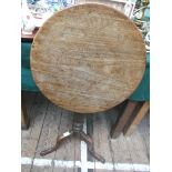 Oak circular tilt topped side table on tricorn base (top 18" diam)