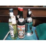 Mid 20th century plated soda syphon and stand and 4 bottles of Martini