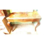 Rectangular topped carving table inlaid in mixed woods with pull out drawer on ornate shaped feet