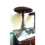 Circular topped side table (approx 20" dia) the heavy supports in the form of coiled snakes on