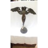 Bronze figure of a winged nude raised on circular plinth (28 1/2" high)