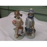 Lladro figure of a young girl with posy and bird in hands and another lladro figure of a young boy