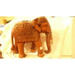 Carved wooden model of an ornately adorned Elephant