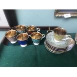 6 individual Alka coffee cups and saucers with gold lustre interior