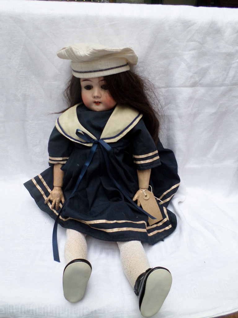 German vintage pot headed Sailor doll, loose limbs black hair, unfixed brown eyes,