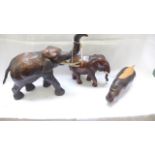 2 smaller Elephant figures and another of a Rhino