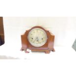 Steel dialed mantelclock in hooded lined oak case, brass mechanism,