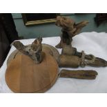 Circular bread board, pair of wooden pestles, wooden carvings etc.
