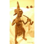 Most unusual metal ornament of a Native Warrior holding a staff and smoking a pipe