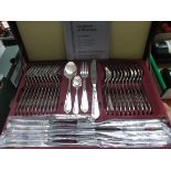 Unused German two tier set of stainless steel cutlery in maroon leather carry canteen