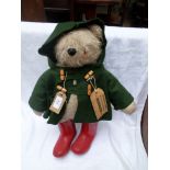 Paddington Bear with felt green overjacket, and red wellies,