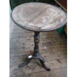 Circular topped side table on tricorn base